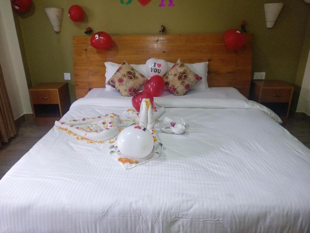 Postel nebo postele na pokoji v ubytování Hotel hornbill