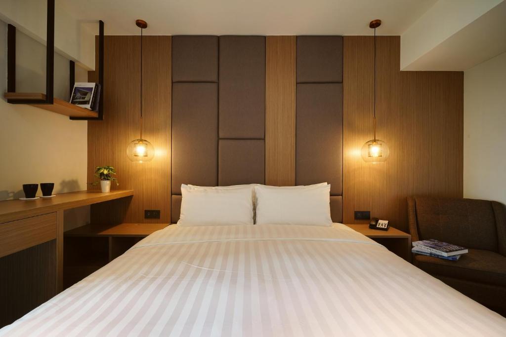 Postel nebo postele na pokoji v ubytování E Hotel