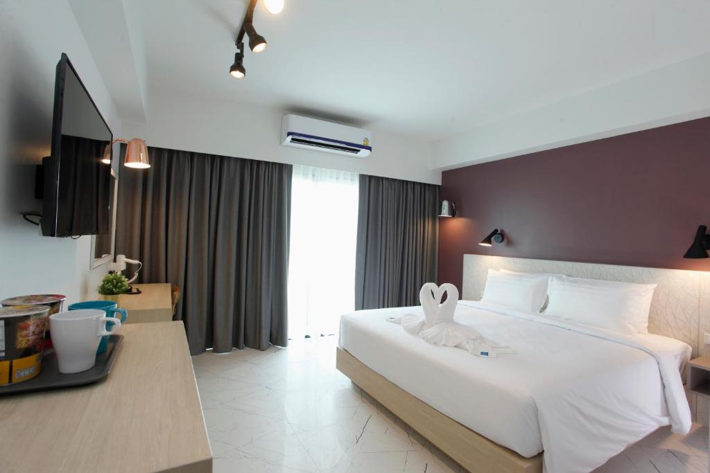 Giường trong phòng chung tại Port Canary Airport Hotel