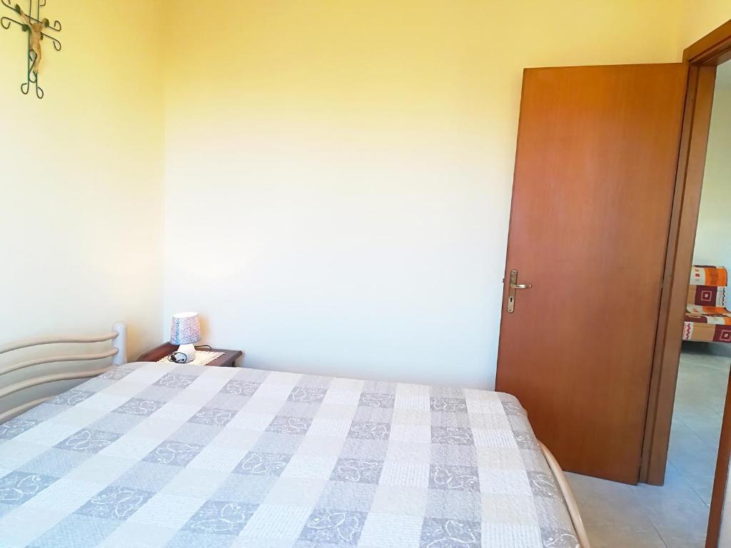 A bed or beds in a room at Near The Beach And The Center Of Otranto - Apartment Eleonora 5 Places