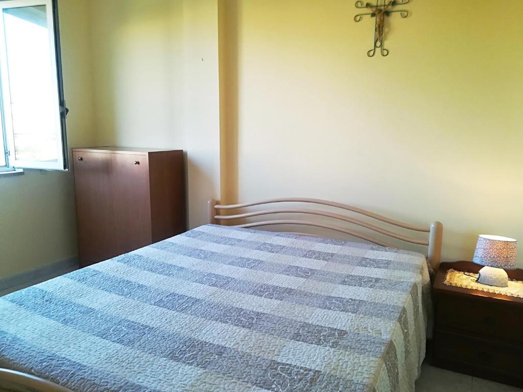 A bed or beds in a room at Near The Beach And The Center Of Otranto - Apartment Eleonora 5 Places