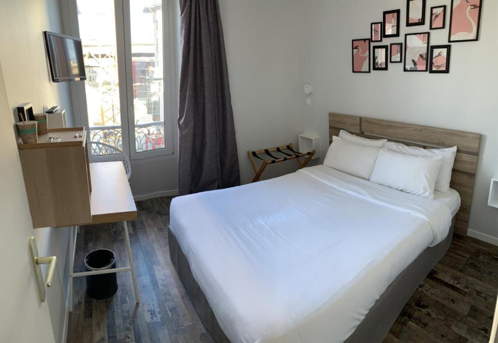 Postel nebo postele na pokoji v ubytování Hotel de Berne