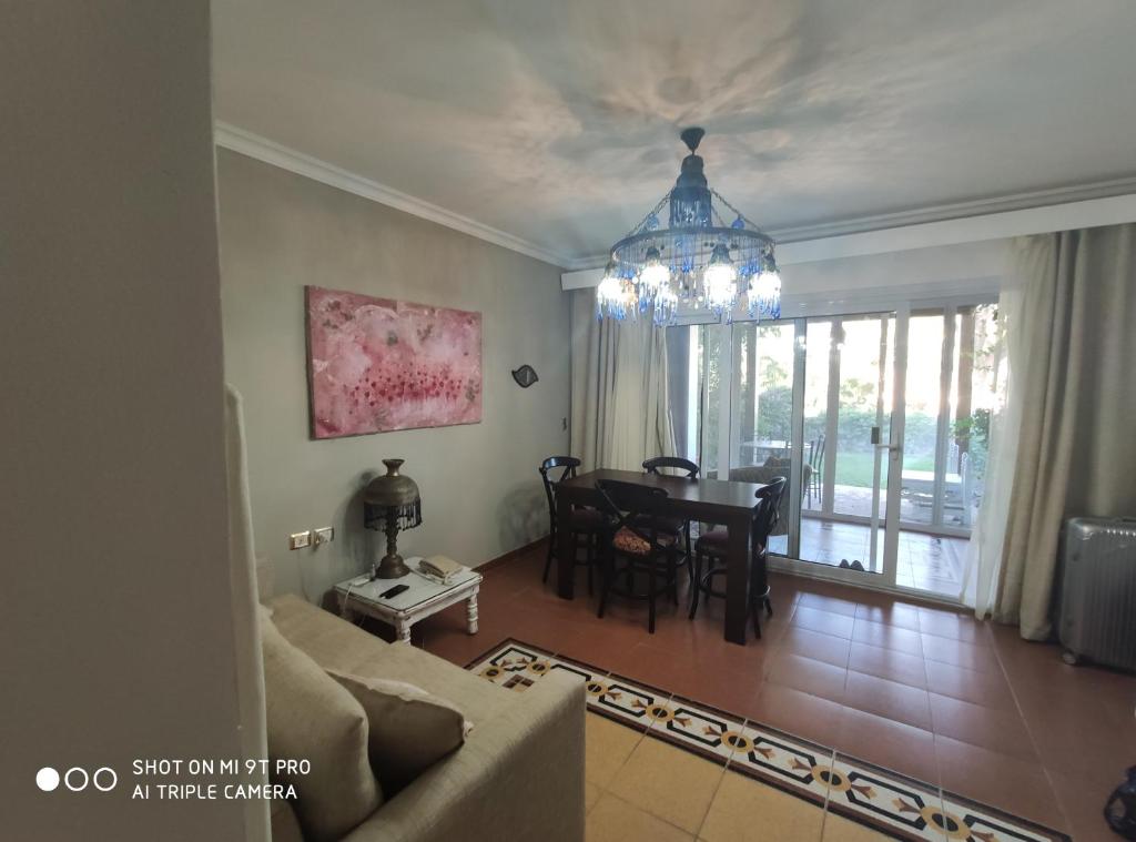 a living room with a couch and a table at sharm suite privata Domina in Sharm El Sheikh