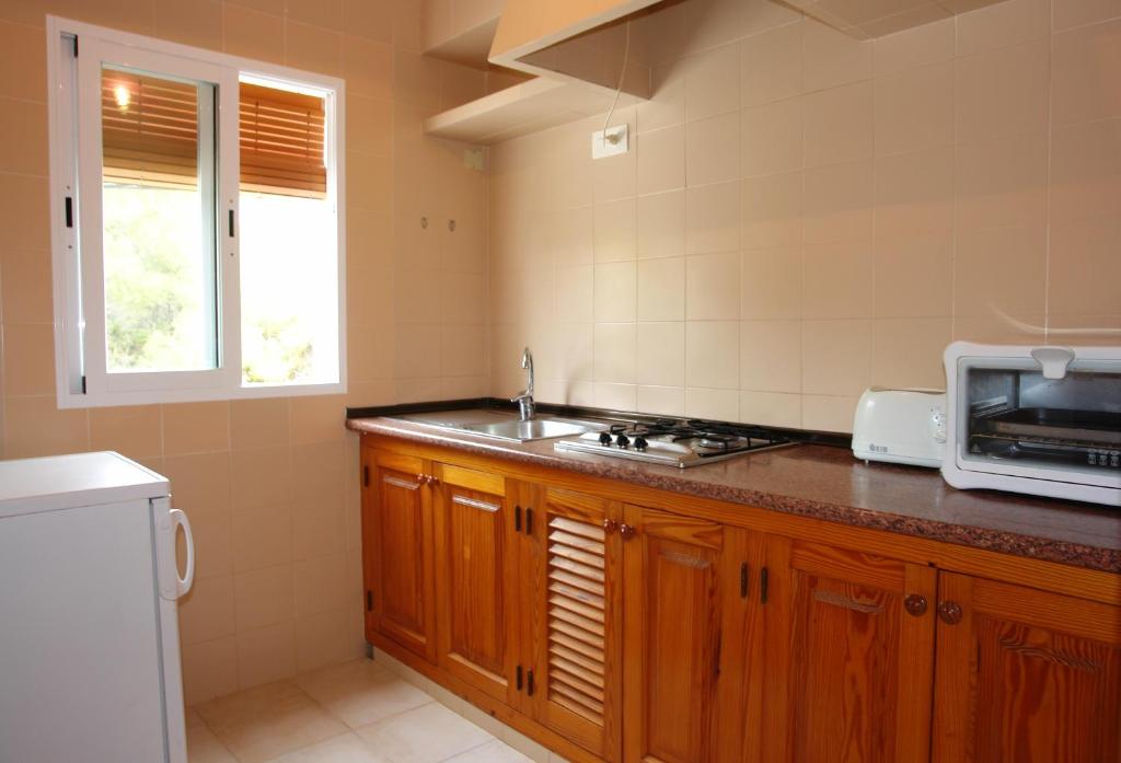 Kuchyň nebo kuchyňský kout v ubytování Apartamentos Escandell - Formentera Vacaciones
