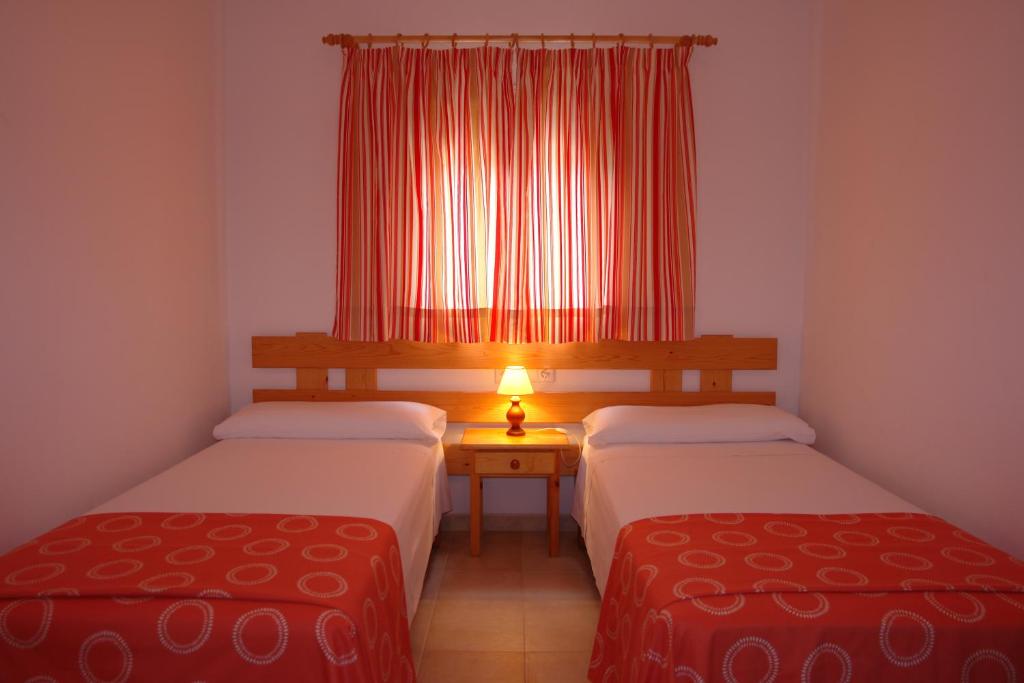 Postel nebo postele na pokoji v ubytování Apartamentos Escandell - Formentera Vacaciones