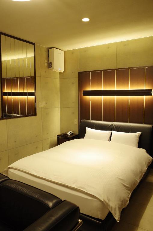 Hotel JOYCEにあるベッド