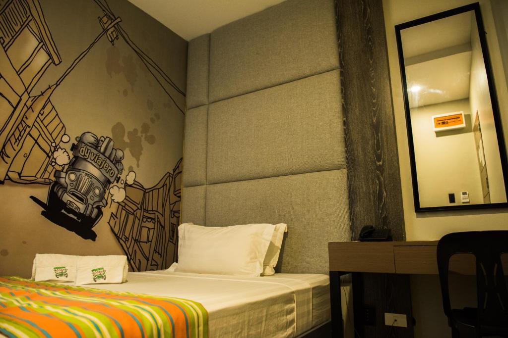 Postel nebo postele na pokoji v ubytování Dy Viajero Transient Hotel