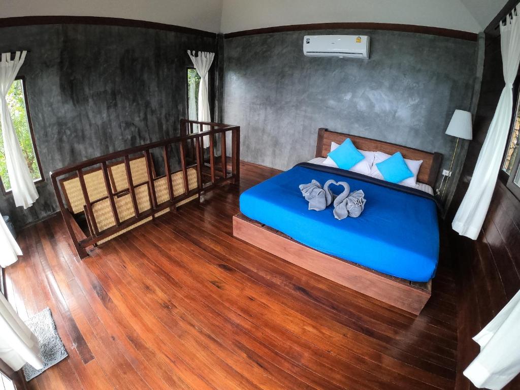 Postel nebo postele na pokoji v ubytování Blue Heaven Resort Koh Tao