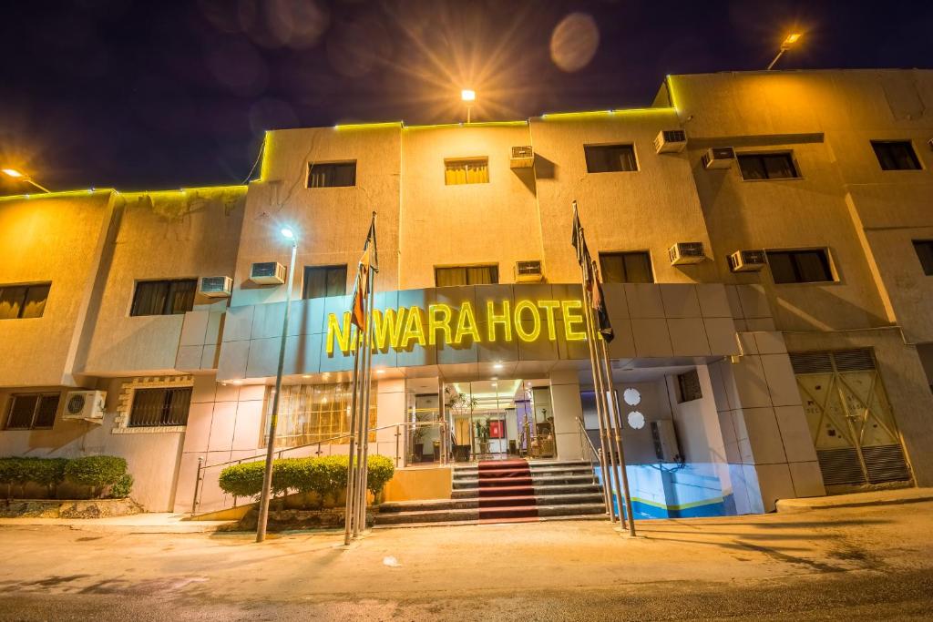 a hotel with a sign on the front of it at Nawarah Al Takhassusi in Riyadh