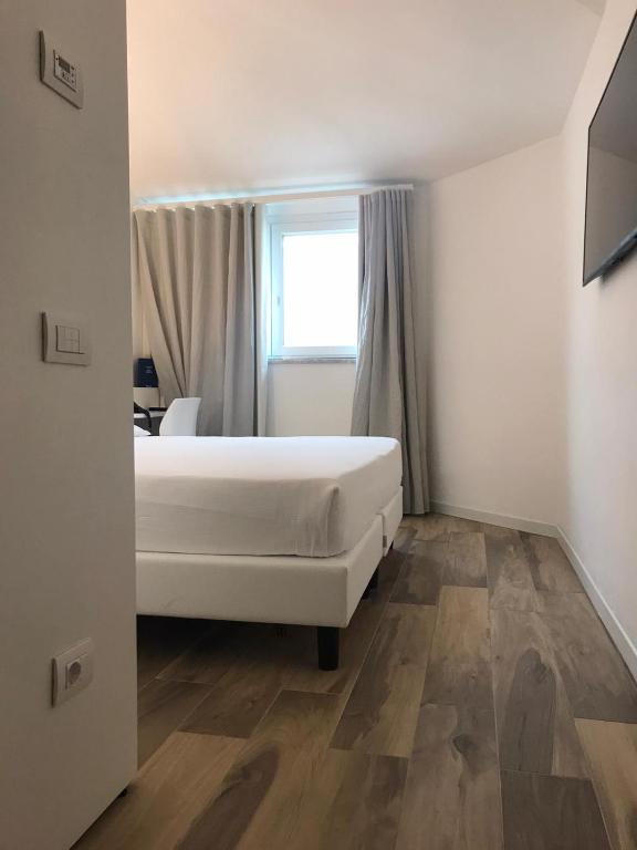 Postel nebo postele na pokoji v ubytování Toscana Charme Resort
