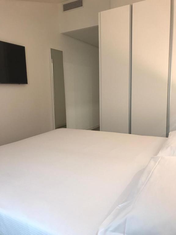 Postel nebo postele na pokoji v ubytování Toscana Charme Resort
