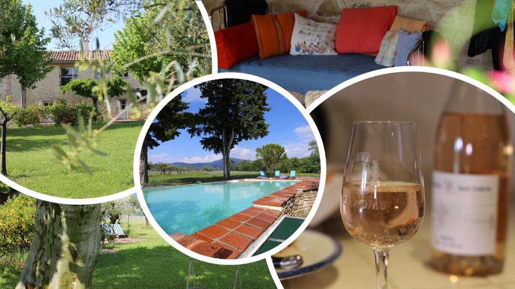 uma mesa com um copo de vinho e uma garrafa de vinho em DOMAINE de MAS CARON Gîte 4* au pied du Ventoux en Provence em Caromb
