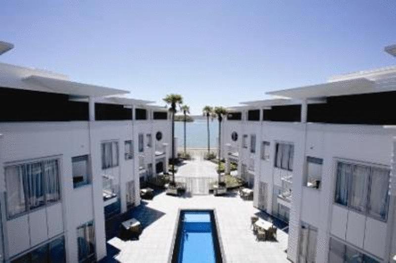 an aerial view of a hotel courtyard with a swimming pool at The Waterfront Suites - Heritage Collection in Paihia