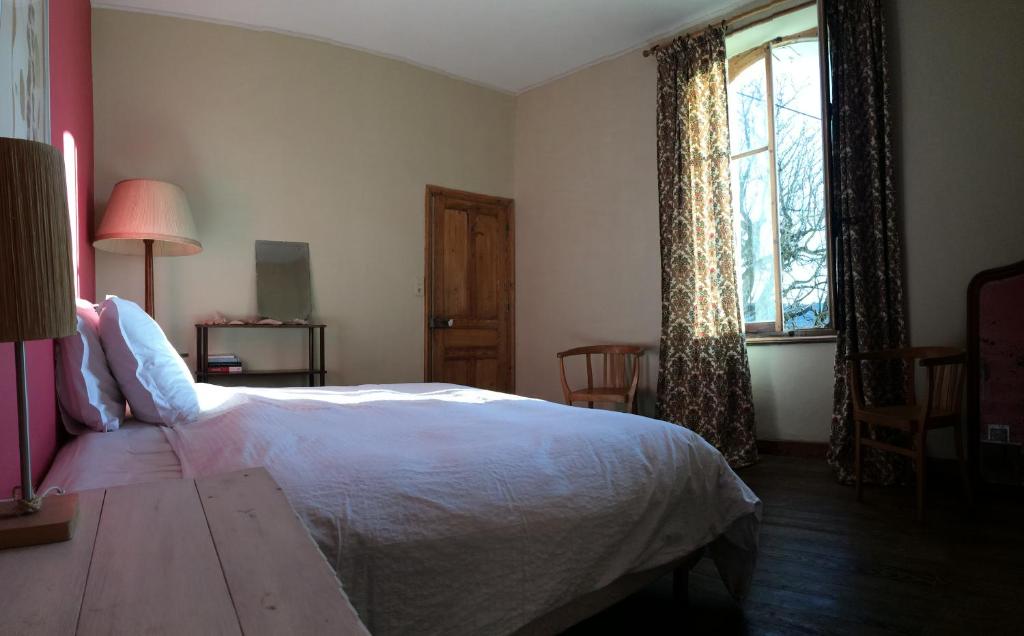 Postel nebo postele na pokoji v ubytování Domaine Fontaine