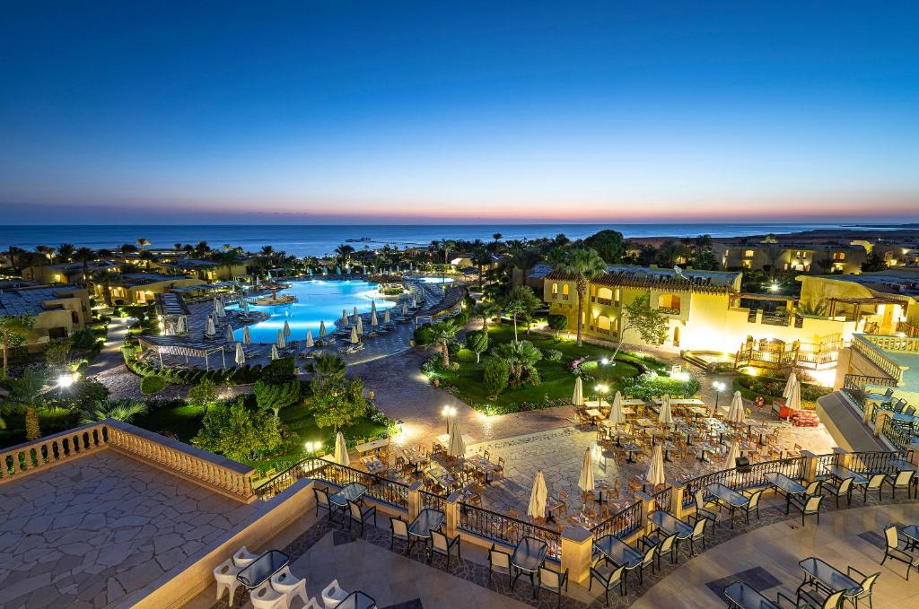 an aerial view of a resort at night at Three Corners Fayrouz Plaza Beach Resort in Port Ghalib