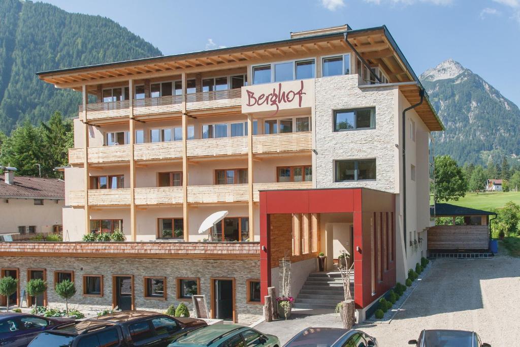 a hotel with cars parked in front of it at Hotel Garni Berghof in Pertisau