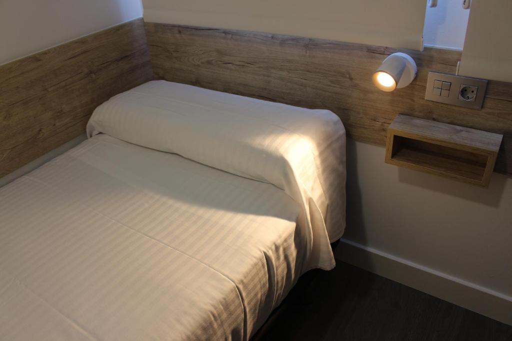Postel nebo postele na pokoji v ubytování Deluxe Hostels & Suites Merida