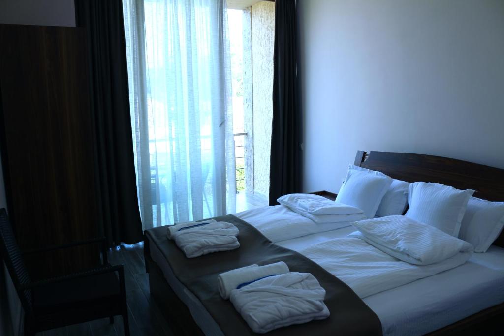 Postel nebo postele na pokoji v ubytování Hotel Lazi