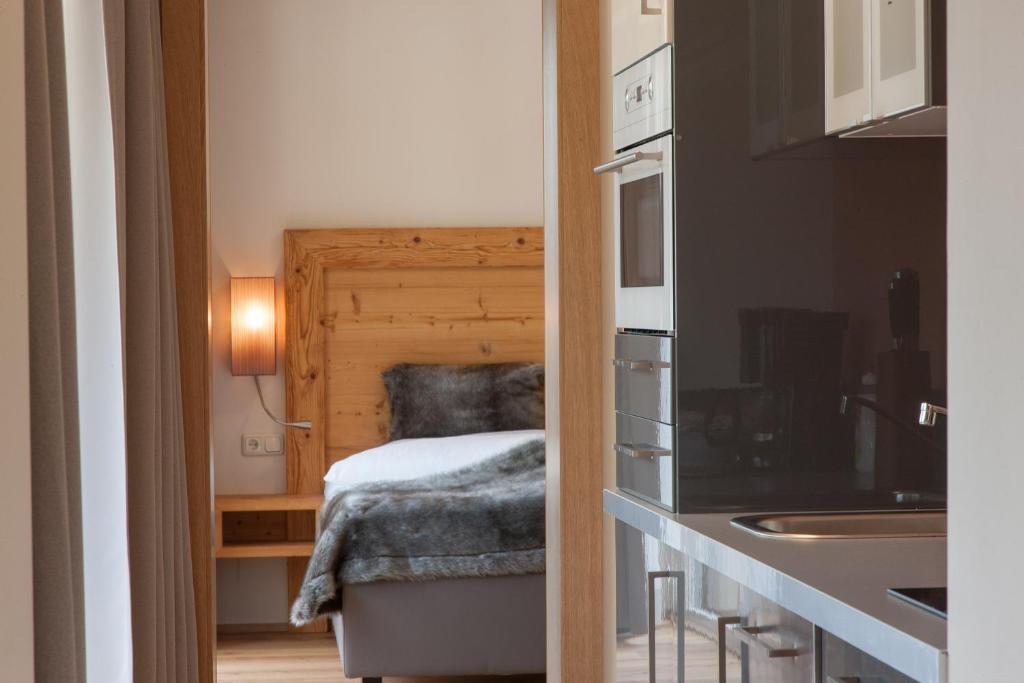 Ένα ή περισσότερα κρεβάτια σε δωμάτιο στο Hotel Garni Berghof