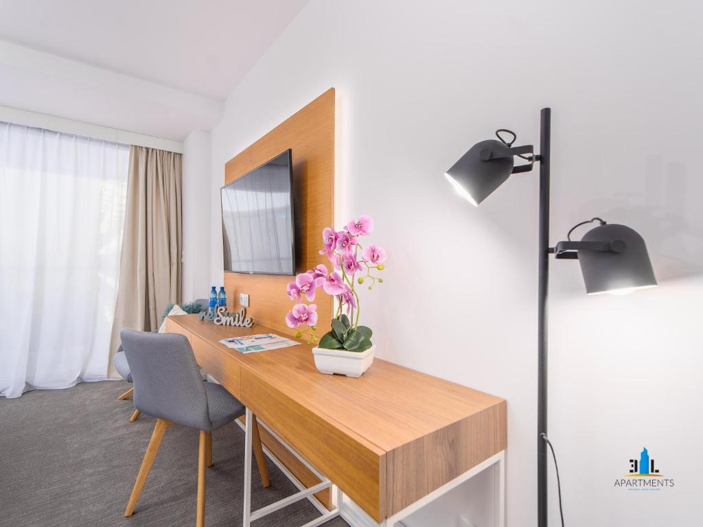 Televízia a/alebo spoločenská miestnosť v ubytovaní 3L Apartments Seaside Park