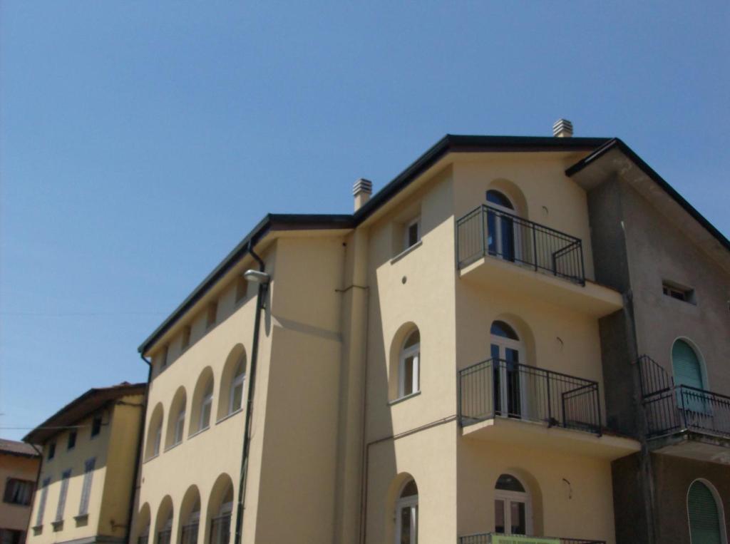a building with balconies on the side of it at Casa Amalia in Boario Terme