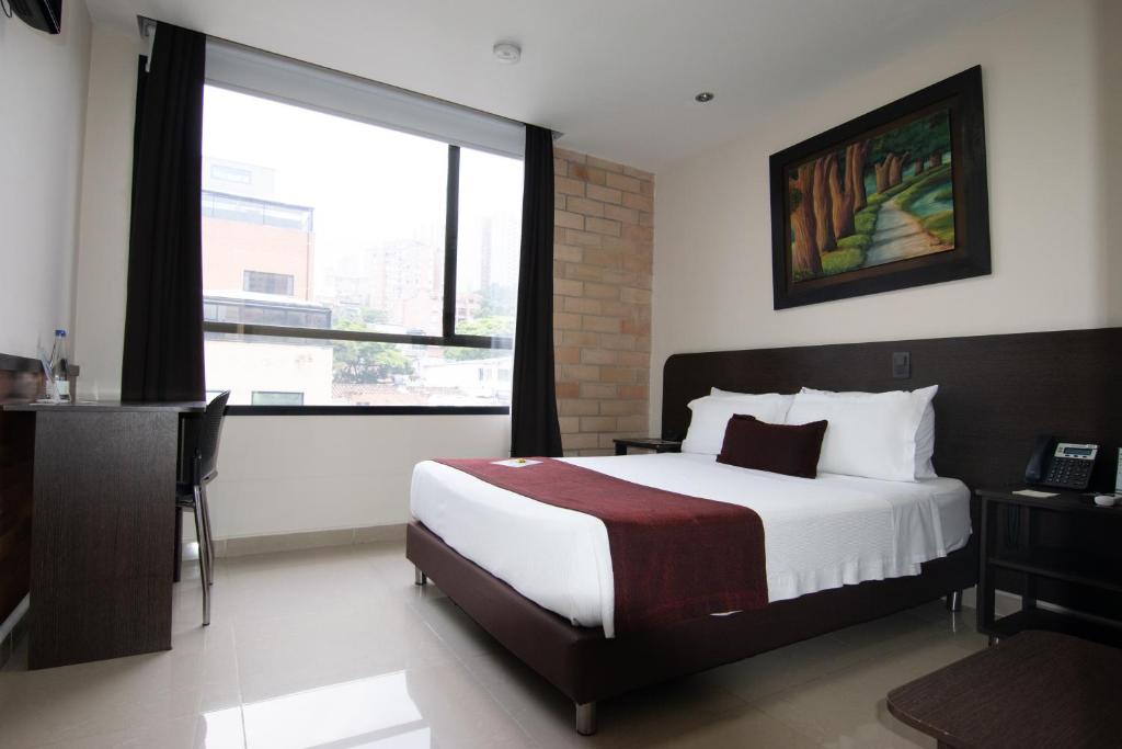 Postel nebo postele na pokoji v ubytování Hotel Acqua Medellín