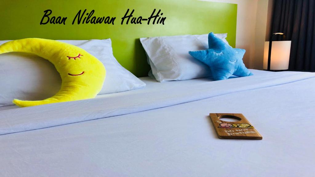 Postel nebo postele na pokoji v ubytování Baan Nilawan Hua Hin Hotel