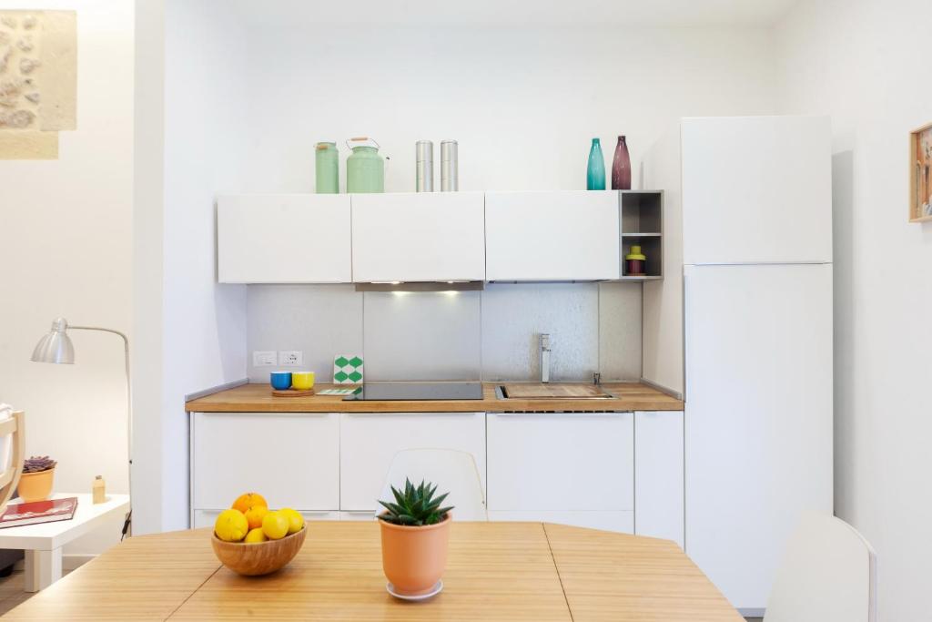 Kuchyňa alebo kuchynka v ubytovaní Mercato di Ortigia Apartments