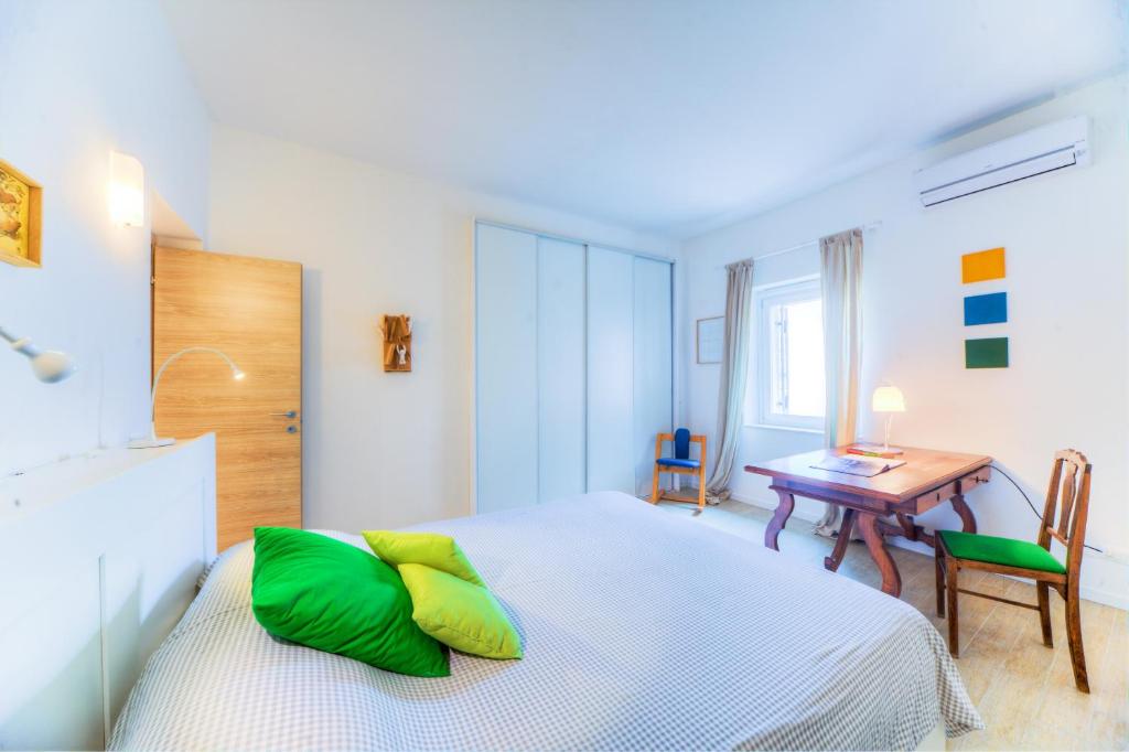 Posteľ alebo postele v izbe v ubytovaní Mercato di Ortigia Apartments