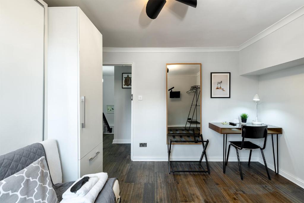 a living room with a couch and a table at HSA - Shoreditch in London