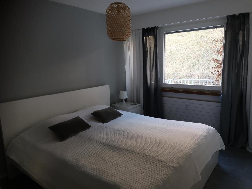 Postel nebo postele na pokoji v ubytování Ferienwohnung in Trin