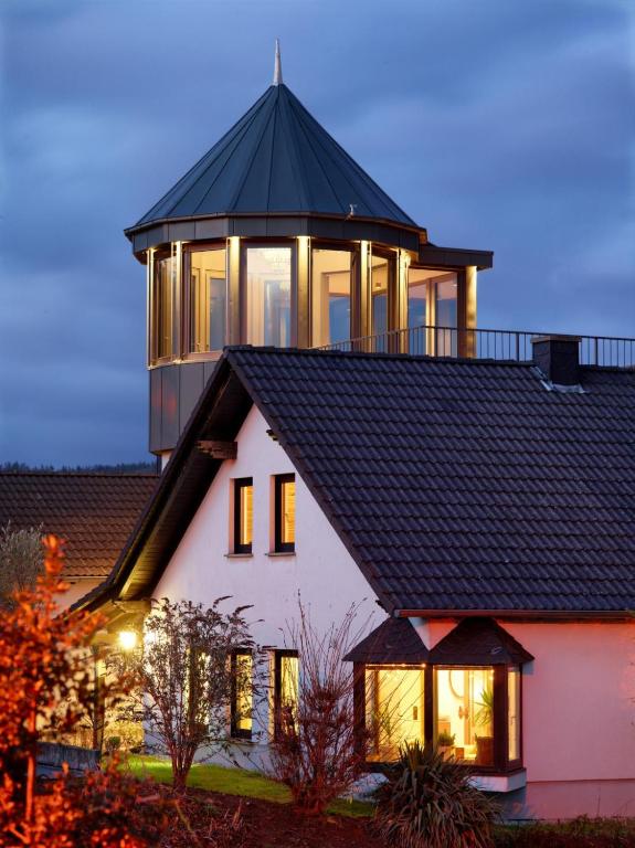 a house with a gazebo on top of it at Weingut Schumann in Lieser