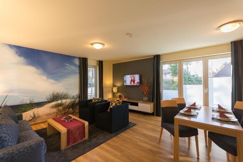 TV a/nebo společenská místnost v ubytování Apartmenthaus Kleiner Falke