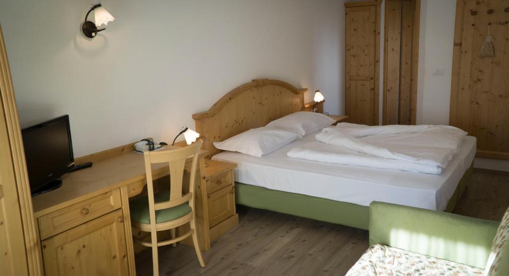 Postel nebo postele na pokoji v ubytování Hotel Innerhofer