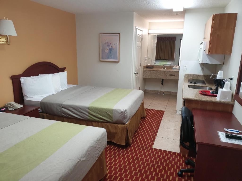 Postel nebo postele na pokoji v ubytování Split Mountain Motel