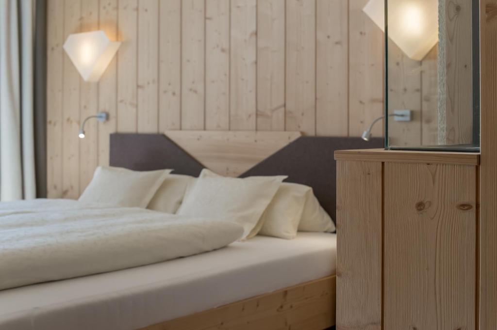 Postel nebo postele na pokoji v ubytování Hotel Garni Pirchhütt