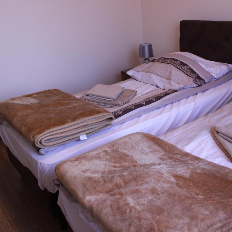 Postel nebo postele na pokoji v ubytování Dom Pielgrzyma