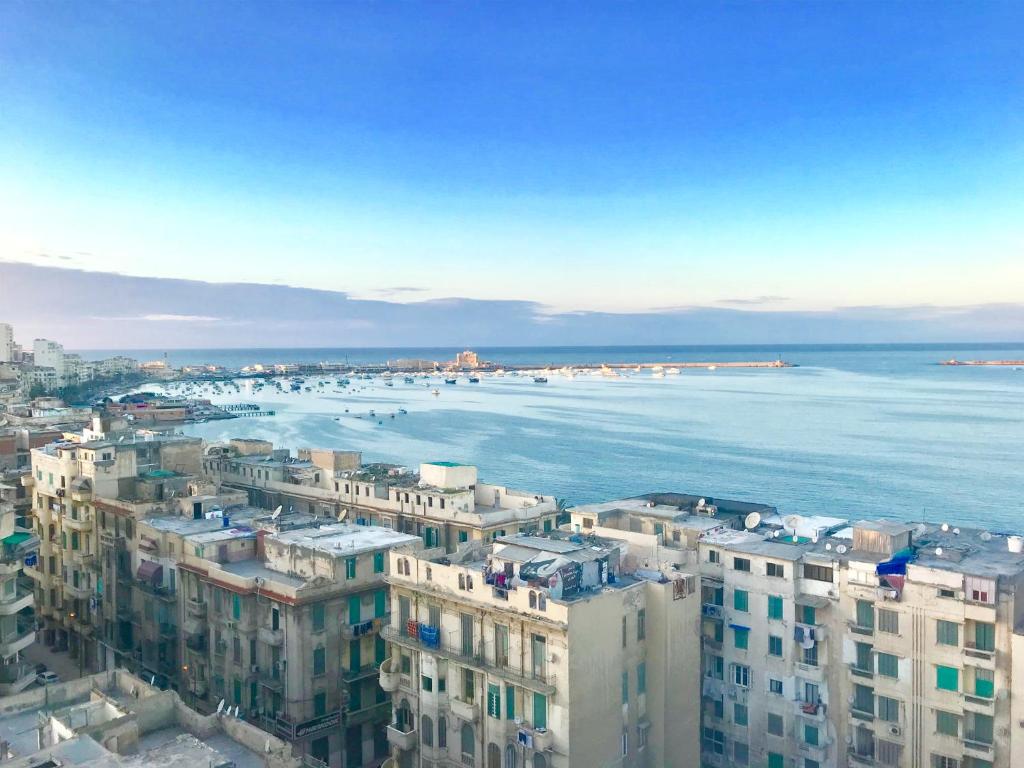 an aerial view of a city and the ocean at Downtown Sea View Suites in Alexandria