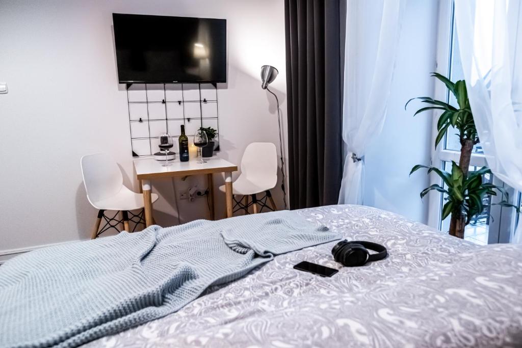 Posteľ alebo postele v izbe v ubytovaní City Center