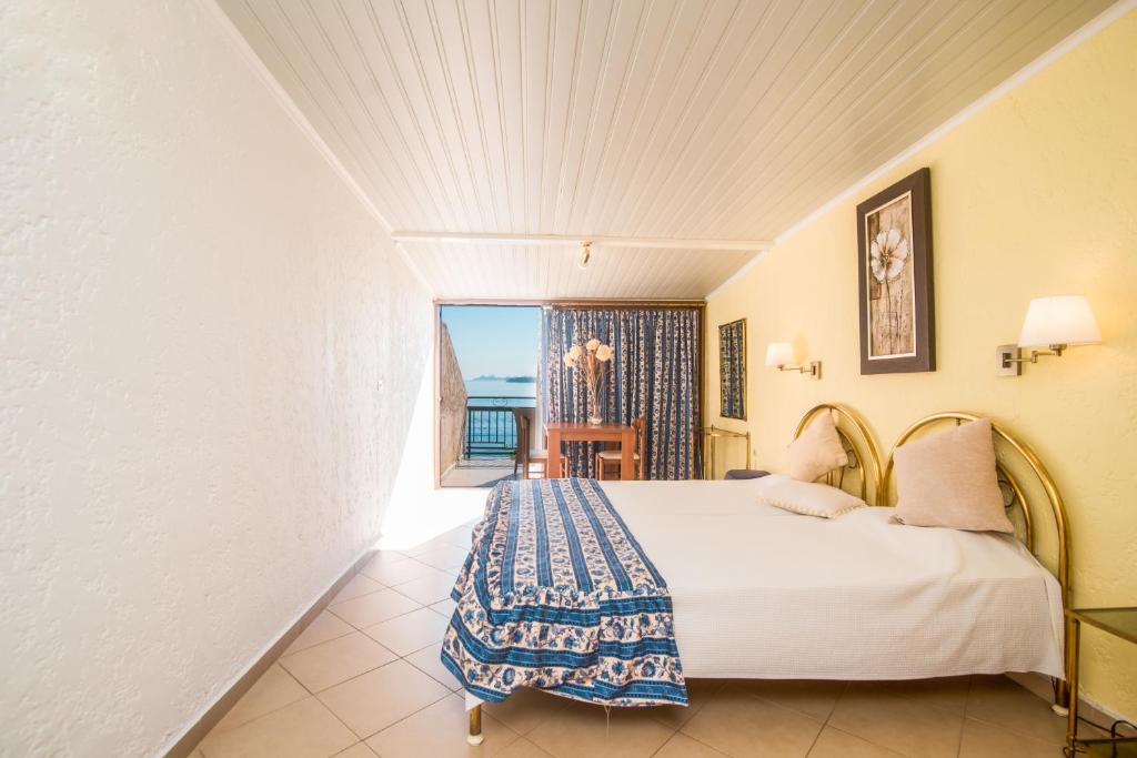 Posteľ alebo postele v izbe v ubytovaní Kommeno Bay Apartments
