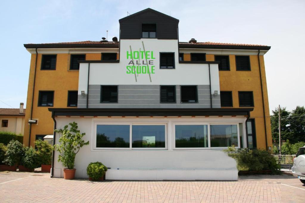 a building with a large window in front of it at Hotel Alle Scuole NEW in Curtarolo