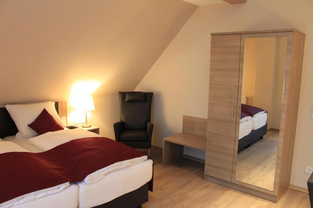 Postel nebo postele na pokoji v ubytování Troll's Brauhaushotel