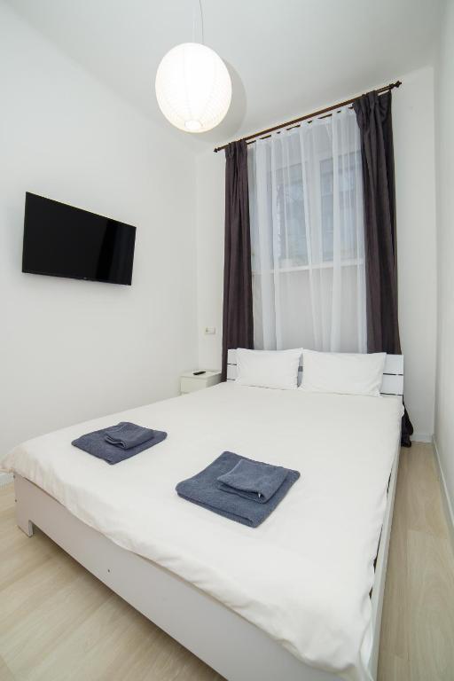 Posteľ alebo postele v izbe v ubytovaní Atlas Hotel