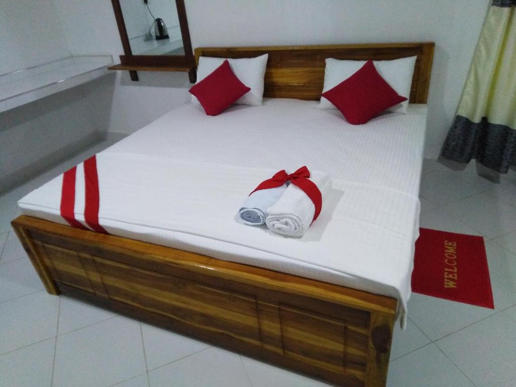 Postel nebo postele na pokoji v ubytování Autumn Home Stay