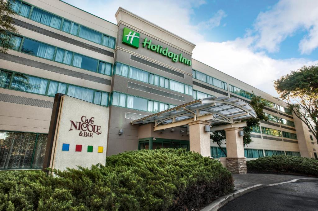 an office building with a sign in front of it at Holiday Inn Princeton, an IHG Hotel in Princeton