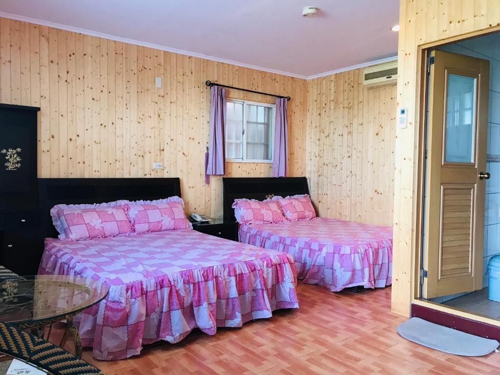 Krevet ili kreveti u jedinici u okviru objekta Huayi Homestay