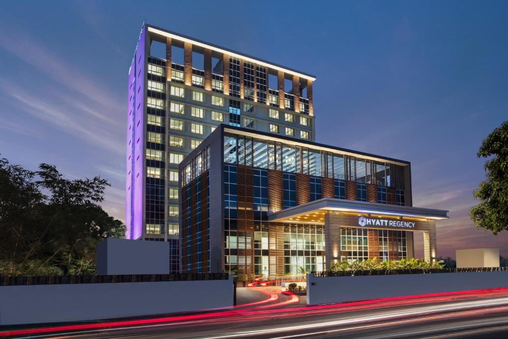 a rendering of a tall building at night at Hyatt Regency Thrissur in Trichūr