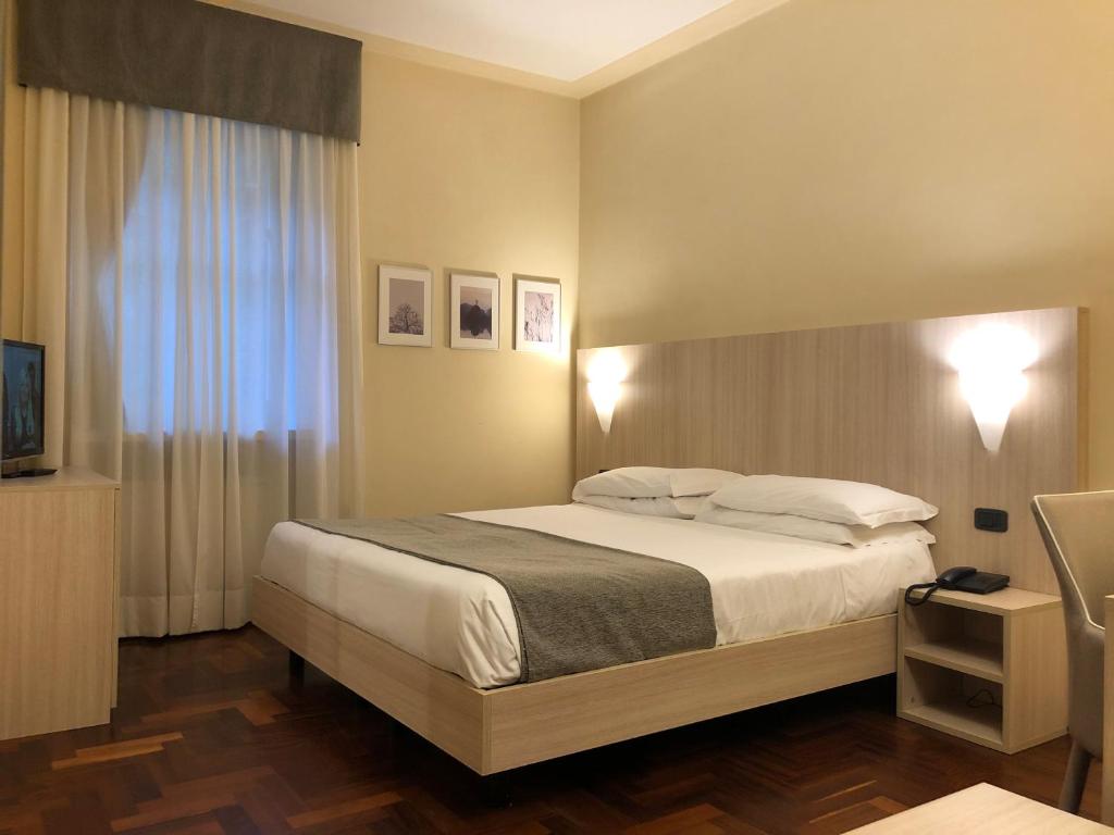 Postel nebo postele na pokoji v ubytování Hotel Boutique Antiche Mura