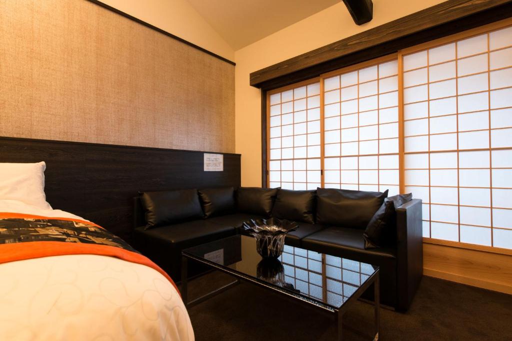 Postel nebo postele na pokoji v ubytování Kamishichiken Oku
