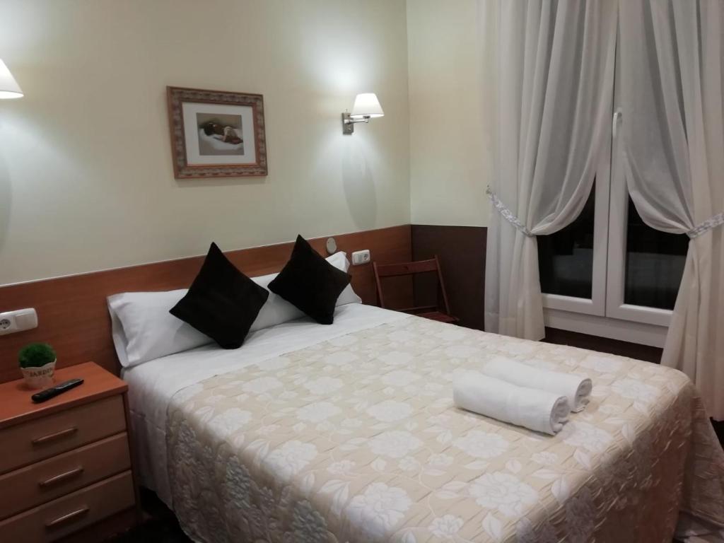 Cama o camas de una habitación en Pensión San Jerónimo